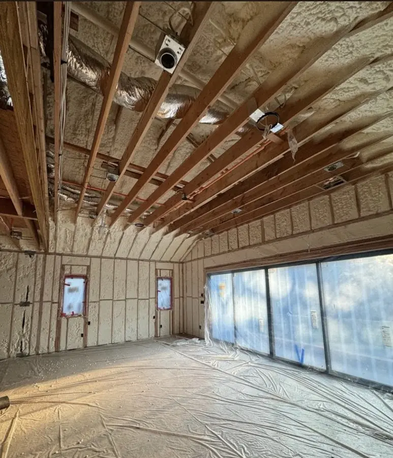 Interior walls and ceiling insulated with spray foam during new construction in Royalton